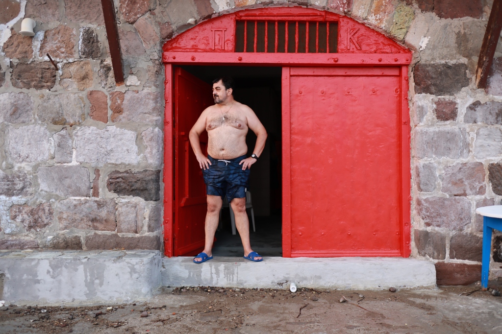 Man in front of his door at Klima